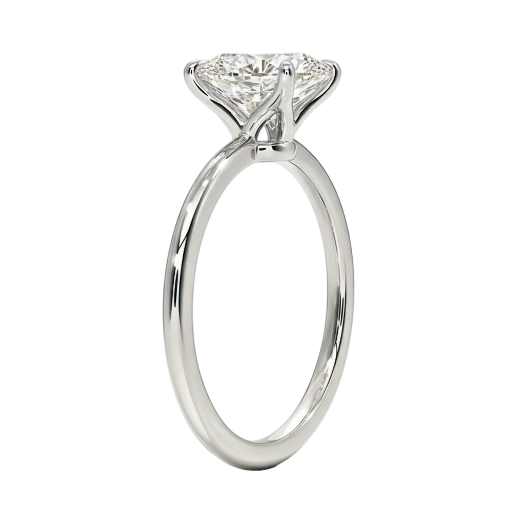 Oval cut Moissanite lab grown diamond engagement ring round shank with a four claw setting, on a gold band, against a white background.Moissanite engagement ring cape town south africa grand diamonds ralph jacobs jeuli