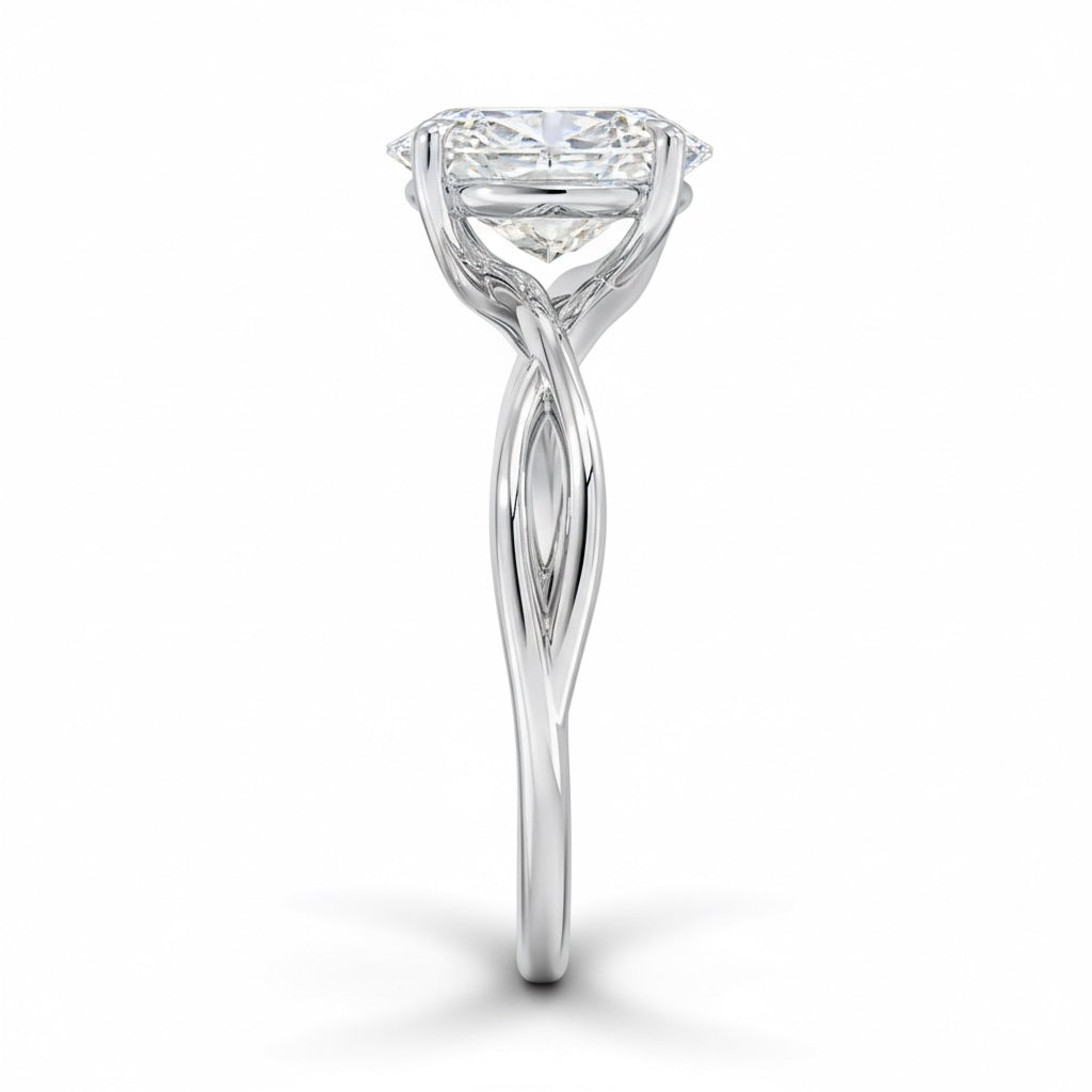 Oval cut Moissanite lab grown diamond engagement ring twisted shank with a four cat-claw setting, on a gold band, against a white background.Moissanite engagement ring cape town south africa grand diamonds ralph jacobs jeuli