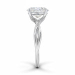 Oval cut Moissanite lab grown diamond engagement ring twisted shank with a four cat-claw setting, on a gold band, against a white background.Moissanite engagement ring cape town south africa grand diamonds ralph jacobs jeuli