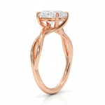 Oval cut Moissanite lab grown diamond engagement ring twisted shank with a four cat-claw setting, on a gold band, against a white background.Moissanite engagement ring cape town south africa grand diamonds ralph jacobs jeuli