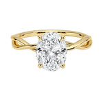 Oval cut Moissanite lab grown diamond engagement ring twisted shank with a four cat-claw setting, on a gold band, against a white background.Moissanite engagement ring cape town south africa grand diamonds ralph jacobs jeuli