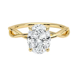 Oval cut Moissanite lab grown diamond engagement ring twisted shank with a four cat-claw setting, on a gold band, against a white background.Moissanite engagement ring cape town south africa grand diamonds ralph jacobs jeuli