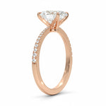 Oval cut Moissanite lab grown diamond engagement ring with tapered pave set shank on a gold band, against a white background.Moissanite engagement ring cape town south africa grand diamonds ralph jacobs jeulia 