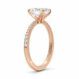 Oval cut Moissanite lab grown diamond engagement ring with tapered pave set shank on a gold band, against a white background.Moissanite engagement ring cape town south africa grand diamonds ralph jacobs jeulia 