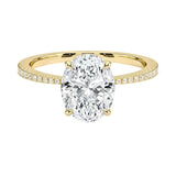 Oval cut Moissanite lab grown diamond engagement ring with tapered pave set shank on a gold band, against a white background.Moissanite engagement ring cape town south africa grand diamonds ralph jacobs jeulia 