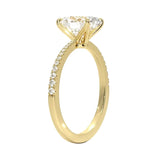 Oval cut Moissanite lab grown diamond engagement ring with tapered pave set shank on a gold band, against a white background.Moissanite engagement ring cape town south africa grand diamonds ralph jacobs jeulia 