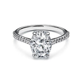 Oval cut Moissanite lab grown diamond engagement ring pave set shank with a four claw setting, on a gold band, against a white background.Moissanite engagement ring cape town south africa grand diamonds ralph jacobs jeulia