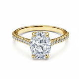 Oval cut Moissanite lab grown diamond engagement ring pave set shank with a four claw setting, on a gold band, against a white background.Moissanite engagement ring cape town south africa grand diamonds ralph jacobs jeulia 