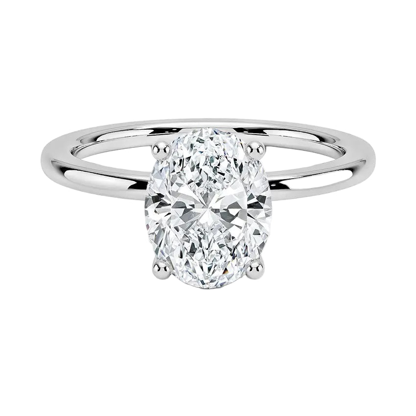 Oval cut Moissanite lab grown diamond engagement ring round shank with pin claw setting, on a gold band, against a white background.Moissanite engagement ring cape town south africa grand diamonds ralph jacobs jeulia 