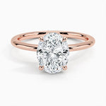 Oval cut Moissanite lab grown diamond engagement ring round shank with a four claw setting, on a gold band, against a white background.Moissanite engagement ring cape town south africa grand diamonds ralph jacobs jeuli