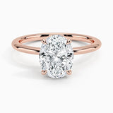 Oval cut Moissanite lab grown diamond engagement ring round shank with a four claw setting, on a gold band, against a white background.Moissanite engagement ring cape town south africa grand diamonds ralph jacobs jeuli