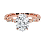 Oval cut Moissanite lab grown diamond engagement ring with twisted single pave set gold shank, against a white background.Moissanite engagement ring cape town south africa grand diamonds ralph jacobs jeulia 