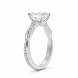 Oval cut Moissanite lab grown diamond engagement ring with twisted single pave set gold shank, against a white background.Moissanite engagement ring cape town south africa grand diamonds ralph jacobs jeulia 