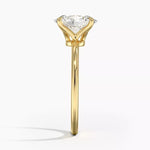 Oval cut Moissanite lab grown diamond engagement ring round shank with a four claw setting, on a gold band, against a white background.Moissanite engagement ring cape town south africa grand diamonds ralph jacobs jeuli