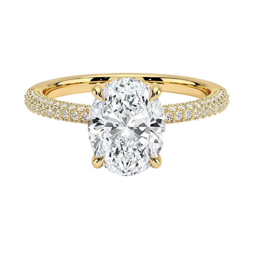 Oval cut Moissanite lab grown diamond engagement ring with three row micro pave set gold shank, hidden halo and encrusted claws against a white background.Moissanite engagement ring cape town south africa grand diamonds ralph jacobs jeulia 