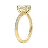 Oval cut Moissanite lab grown diamond engagement ring with three row micro pave set gold shank, hidden halo and encrusted claws against a white background.Moissanite engagement ring cape town south africa grand diamonds ralph jacobs jeulia 