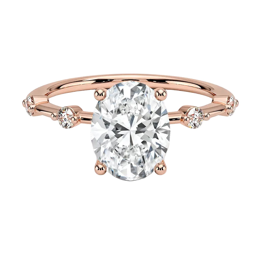 Oval cut Moissanite lab grown diamond engagement ring with tube set small round moissanites on the shank, on a gold band, against a white background.Moissanite engagement ring cape town south africa grand diamonds ralph jacobs jeulia 