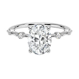 Oval cut Moissanite lab grown diamond engagement ring with tube set small round moissanites on the shank, on a gold band, against a white background.Moissanite engagement ring cape town south africa grand diamonds ralph jacobs jeulia 