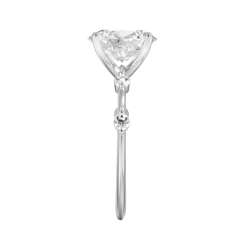 Oval cut Moissanite lab grown diamond engagement ring with tube set small round moissanites on the shank, on a gold band, against a white background.Moissanite engagement ring cape town south africa grand diamonds ralph jacobs jeulia 