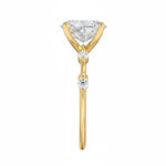 Oval cut Moissanite lab grown diamond engagement ring with tube set small round moissanites on the shank, on a gold band, against a white background.Moissanite engagement ring cape town south africa grand diamonds ralph jacobs jeulia 