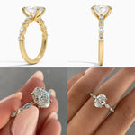 Oval cut Moissanite lab grown diamond engagement ring with tube set small round moissanites on the shank, on a gold band, against a white background.Moissanite engagement ring cape town south africa grand diamonds ralph jacobs jeulia 