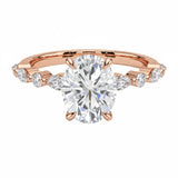 Oval cut Moissanite lab grown diamond engagement ring with tube set small round moissanites on the shank, on a gold band, against a white background.Moissanite engagement ring cape town south africa grand diamonds ralph jacobs jeulia 