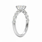 Oval cut Moissanite lab grown diamond engagement ring with tube set small round moissanites on the shank, on a gold band, against a white background.Moissanite engagement ring cape town south africa grand diamonds ralph jacobs jeulia 