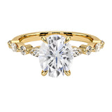 Oval cut Moissanite lab grown diamond engagement ring with tube set small round moissanites on the shank, on a gold band, against a white background.Moissanite engagement ring cape town south africa grand diamonds ralph jacobs jeulia 