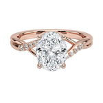 Oval cut Moissanite lab grown diamond engagement ring twisted v shank set with shared prong stones on a gold shank, against a white background.Moissanite engagement ring cape town south africa grand diamonds ralph jacobs jeulia 