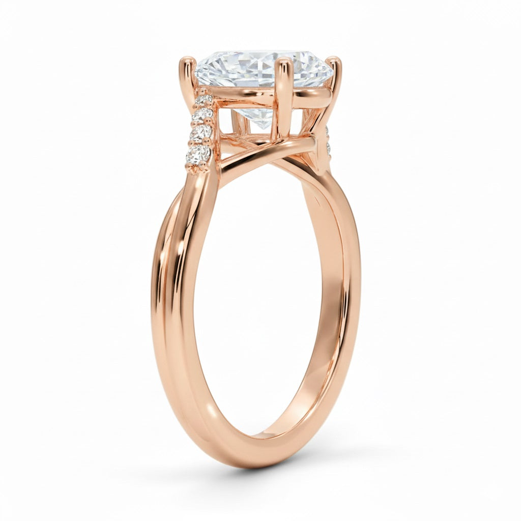 Oval cut Moissanite lab grown diamond engagement ring twisted v shank set with shared prong stones on a gold shank, against a white background.Moissanite engagement ring cape town south africa grand diamonds ralph jacobs jeulia 