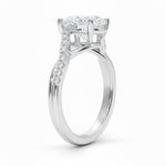 Oval cut Moissanite lab grown diamond engagement ring twisted v shank set with shared prong stones on a gold shank, against a white background.Moissanite engagement ring cape town south africa grand diamonds ralph jacobs jeulia 