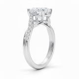 Oval cut Moissanite lab grown diamond engagement ring twisted v shank set with shared prong stones on a gold shank, against a white background.Moissanite engagement ring cape town south africa grand diamonds ralph jacobs jeulia 