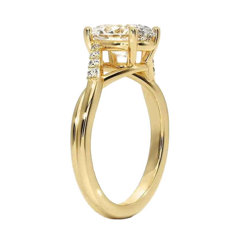 Oval cut Moissanite lab grown diamond engagement ring twisted v shank set with shared prong stones on a gold shank, against a white background.Moissanite engagement ring cape town south africa grand diamonds ralph jacobs jeulia 