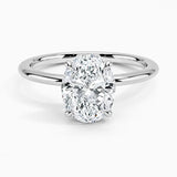 Oval cut Moissanite lab grown diamond engagement ring round shank with a four claw setting, on a gold band, against a white background.Moissanite engagement ring cape town south africa grand diamonds ralph jacobs jeuli