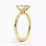 Oval cut Moissanite lab grown diamond engagement ring round shank with a four claw setting, on a gold band, against a white background.Moissanite engagement ring cape town south africa grand diamonds ralph jacobs jeuli