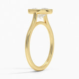Oval shape Moissanite lab grown diamond engagement ring round shank with a bezel setting, on a gold band, against a white background.Moissanite engagement ring cape town south africa grand diamonds ralph jacobs jeulia 