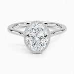 Oval shape Moissanite lab grown diamond engagement ring round shank with a bezel setting, on a gold band, against a white background.Moissanite engagement ring cape town south africa grand diamonds ralph jacobs jeulia 