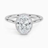 Oval shape Moissanite lab grown diamond engagement ring round shank with a bezel setting, on a gold band, against a white background.Moissanite engagement ring cape town south africa grand diamonds ralph jacobs jeulia 