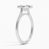 Oval shape Moissanite lab grown diamond engagement ring round shank with a bezel setting, on a gold band, against a white background.Moissanite engagement ring cape town south africa grand diamonds ralph jacobs jeulia 