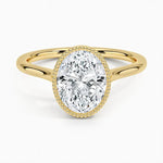Oval shape Moissanite lab grown diamond engagement ring round shank with a bezel setting, on a gold band, against a white background.Moissanite engagement ring cape town south africa grand diamonds ralph jacobs jeulia 