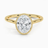 Oval shape Moissanite lab grown diamond engagement ring round shank with a bezel setting, on a gold band, against a white background.Moissanite engagement ring cape town south africa grand diamonds ralph jacobs jeulia 