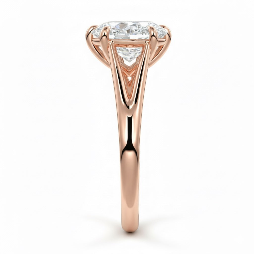 Pear cut Moissanite lab grown diamond engagement ring v-split band with a three claw cathedral setting, on a gold band, against a white background.Moissanite engagement ring cape town south africa grand diamonds ralph jacobs jeulia