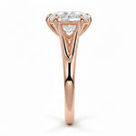 Pear cut Moissanite lab grown diamond engagement ring v-split band with a three claw cathedral setting, on a gold band, against a white background.Moissanite engagement ring cape town south africa grand diamonds ralph jacobs jeulia