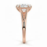 Pear cut Moissanite lab grown diamond engagement ring v-split band with a three claw cathedral setting, on a gold band, against a white background.Moissanite engagement ring cape town south africa grand diamonds ralph jacobs jeulia