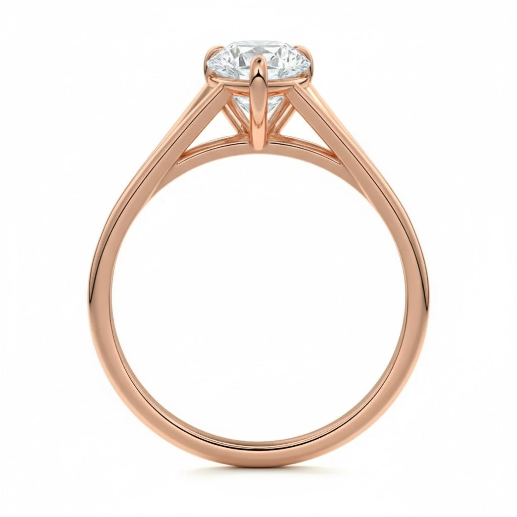 Pear cut Moissanite lab grown diamond engagement ring v-split band with a three claw cathedral setting, on a gold band, against a white background.Moissanite engagement ring cape town south africa grand diamonds ralph jacobs jeulia