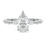 Pear cut Moissanite lab grown diamond engagement ring half eternity fancy set shank with classic three prong setting, on a gold band, against a white background.Moissanite engagement ring cape town south africa grand diamonds ralph jacobs jeulia 