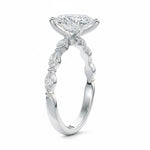 Pear cut Moissanite lab grown diamond engagement ring half eternity fancy set shank with classic three prong setting, on a gold band, against a white background.Moissanite engagement ring cape town south africa grand diamonds ralph jacobs jeulia 