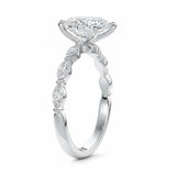 Pear cut Moissanite lab grown diamond engagement ring half eternity fancy set shank with classic three prong setting, on a gold band, against a white background.Moissanite engagement ring cape town south africa grand diamonds ralph jacobs jeulia 