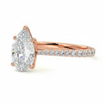 Pear cut Moissanite lab grown diamond engagement ring pave set shank with cathedral setting, on a gold band, against a white background.Moissanite engagement ring cape town south africa grand diamonds ralph jacobs jeulia 