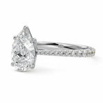 Pear cut Moissanite lab grown diamond engagement ring pave set shank with cathedral setting, on a gold band, against a white background.Moissanite engagement ring cape town south africa grand diamonds ralph jacobs jeulia 